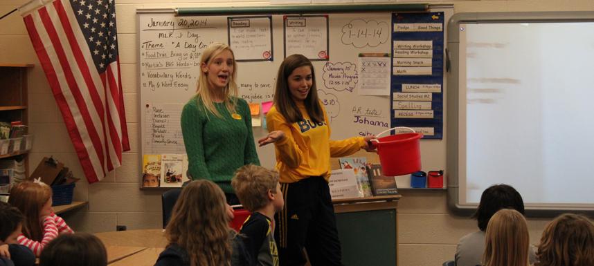 Mattson and Harding act out How Full is Your Bucket by Tom Rath and Mary Reckmeyer to Barb Andres third-grade class at Rosy Mound elementary.