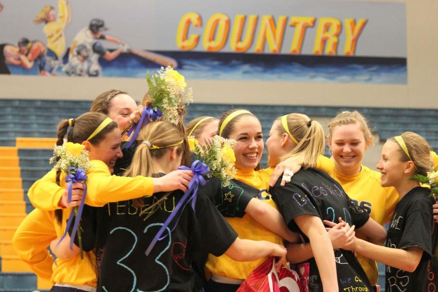 Seniors and juniors hugging with joy after the six senior girls, Katie Harding, Mallory Beswick, Faith Platz, Taylor Cramer, Baliey TeBeau and Emily Sexton got announced before the game.