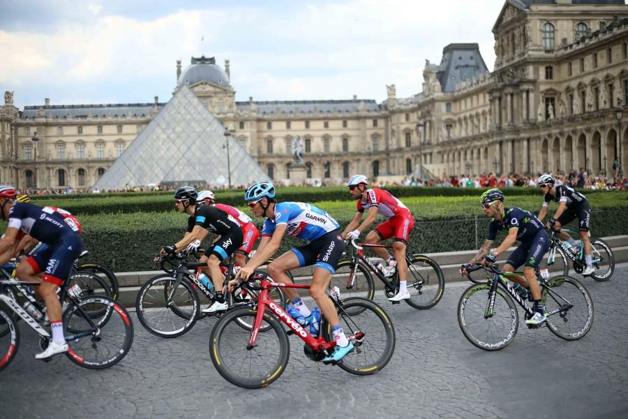 Tour de France bikers fly past the Louvre Museum during the final day of the race. 