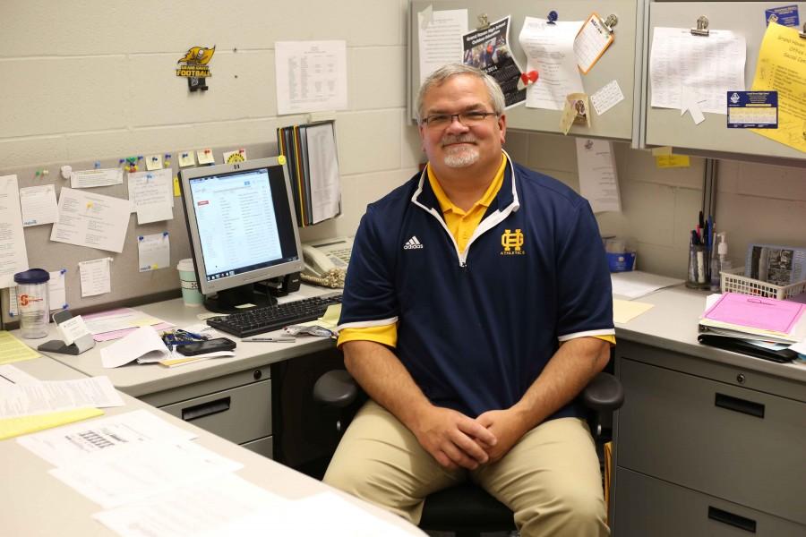 New+athletic+director+Scott+Robertson+poses+in+his+office+before+the+start+of+the+school+year.+Robertson+has+been+working+through+much+of+the+summer+to+prepare+for+the+fall+sports+season.