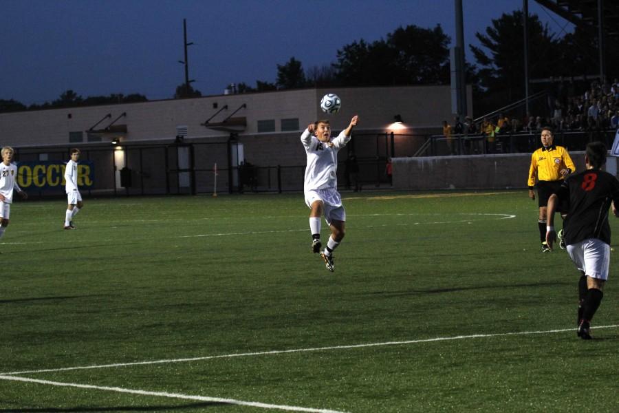 Senior Christian Dault rises up for a header in Wednesday nights contest.