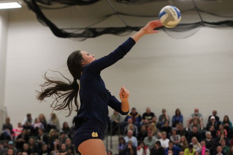 Junior middle hitter Ally Knoll spikes the ball during Thursday nights contest. Knoll had seven kills on the night and has recently made a verbal commit to play volleyball for Central Michigan University after graduation.