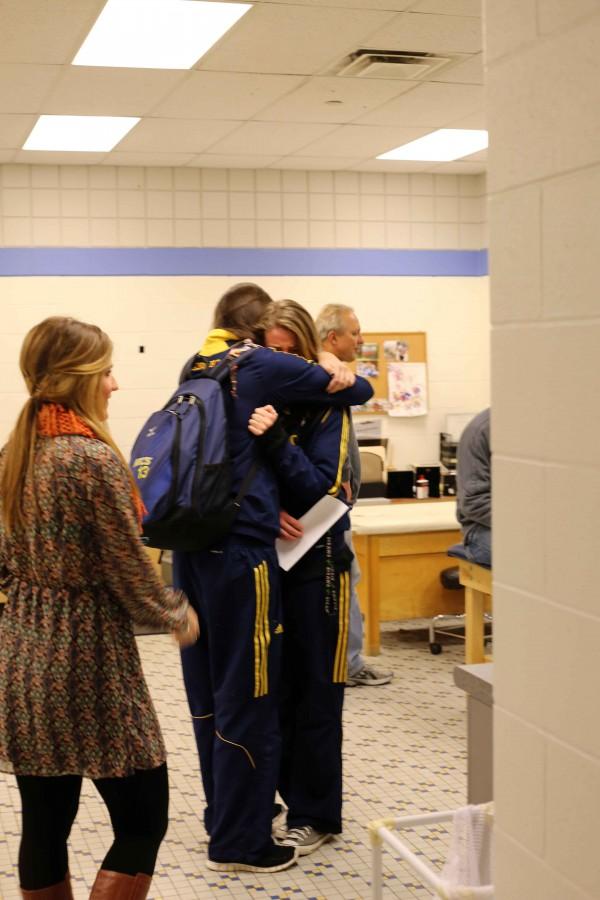 Before the send off, coach Aaron Smaka read a not from former player Abby Cole. Nevers and excitement fill the room, and player Ally Knoll gives loving hug to teammate Kenzie Ritzema.