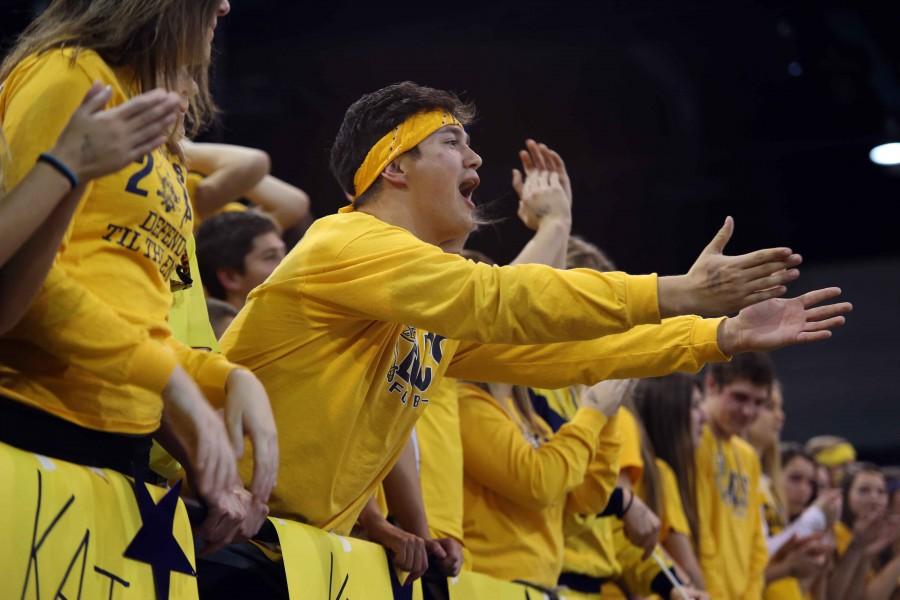 Spectator Cam Shelton expresses his emotions after a call. The grand haven student section was filled with energetic fans who traveled to Battle Creek to support the team.
