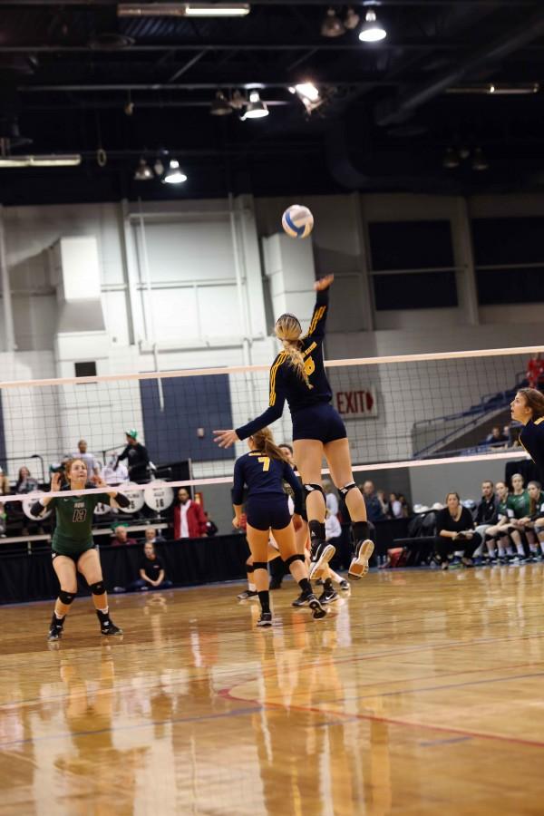 Player Autumn Monsma jumps for a back row attack during the 3rd set against Novi.