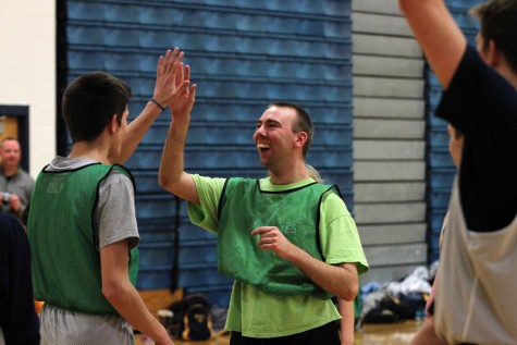 Sophomore Zac Holman and Mikey high five during the game
