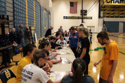 After a few basketball drills and a friendly basketball game, each player signed a poster for every participant.
