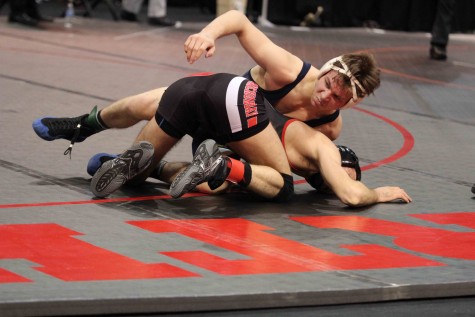 Senior Camden Bertucci attempts to belly out Anchors Bay's 130-pound wrestler. Bertucci wrestled at 130-pounds for the state quarterfinals but is currently ranked  No. 2 in the state for 125-pounds. Bertucci defeated Anchor Bay in a 5-2 decision to put up three points for the Buccaneers. 