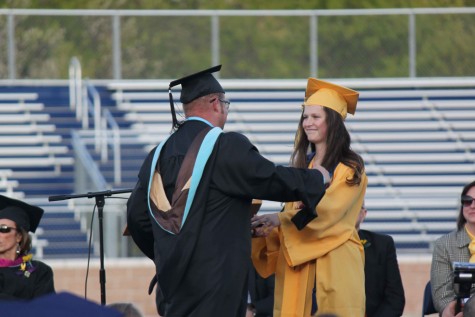 Mackenzie Burkhardt presents teacher Brian Williams with one of the faculty of the year awards. "You need someone to be the ripple that will later on create the waves," Burkhardt said. "If it wasn't for this individual (Williams), half of the things we accomplished this year wouldn't have been possible."