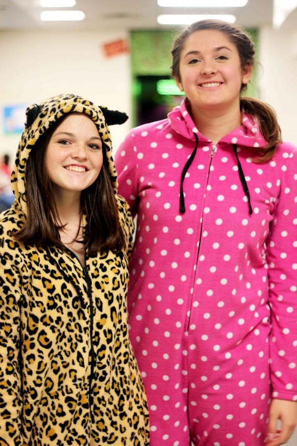 Mary McGinnis (left)  and Kathryn Jaeger (right) show off their colorful onesie's on PJ day.