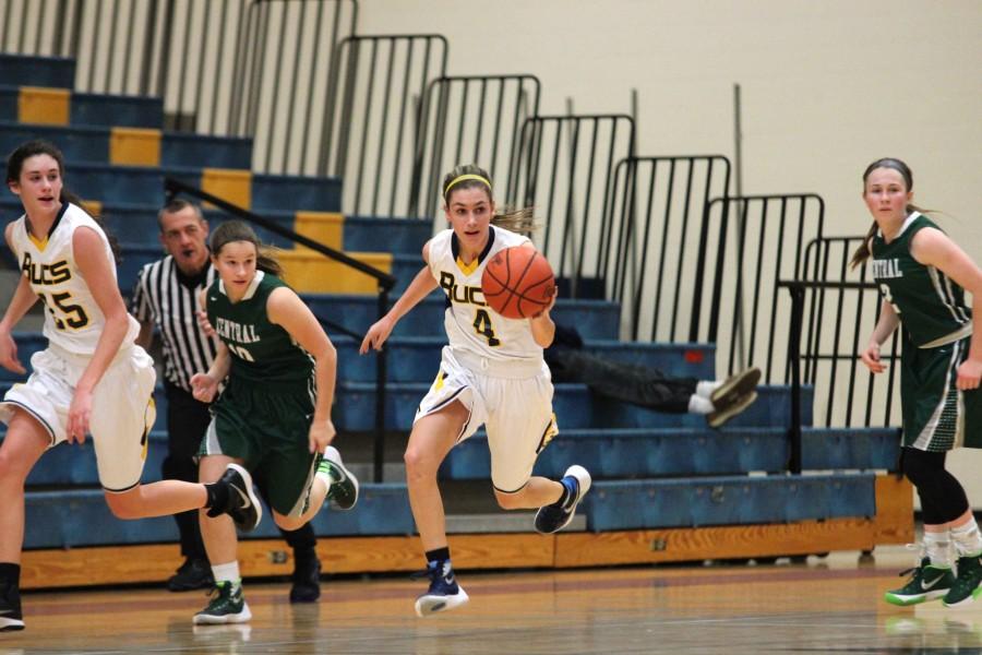 Freshmen Alli Keyser dribbles the ball down the court past the Ranger defense, Keyser led the team with a total of 14 points. 