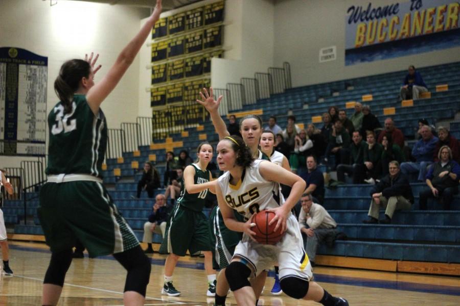 Going up: Junior Lynn Olthof drives to the basket in the second half. Olthof finished the game with 9 points.