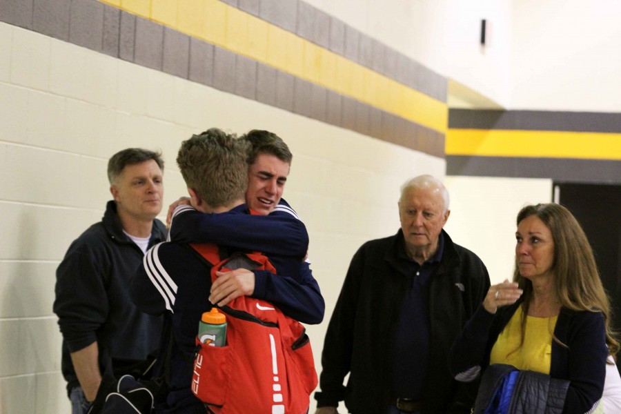 Juniors Clay Landsman and Jack Riopelle have an emotional moment after coming off the court Friday night. 