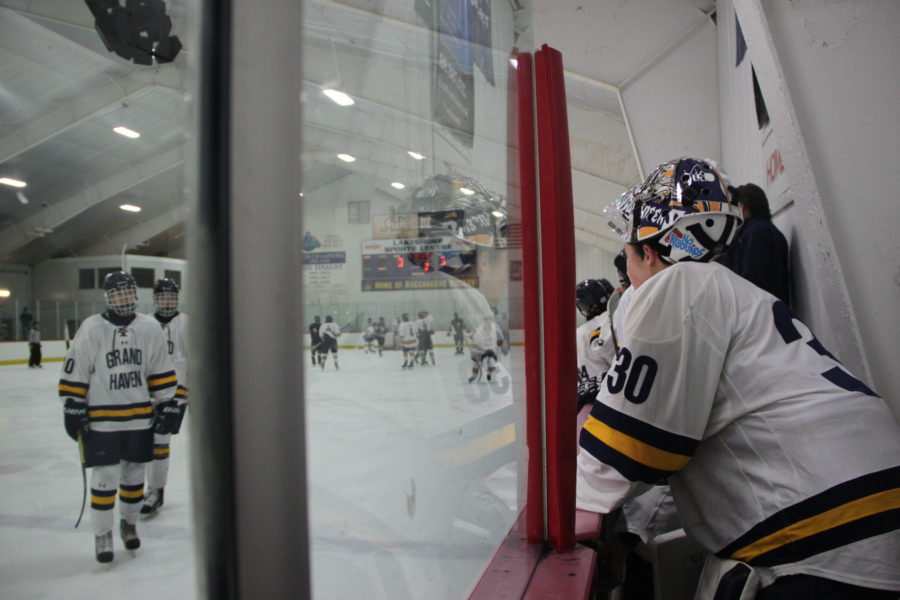Junior goalie Finn Bylsma watches as his teammates skate off the ice following warm-ups before a game against West Ottawa earlier in the season. 