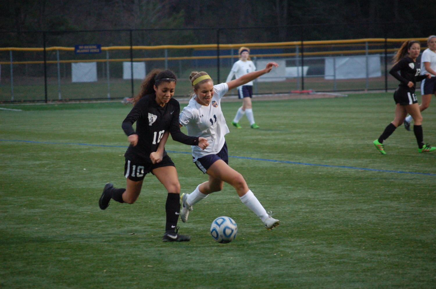 Sophomore Dahlia Jerovsek overpowers her opponent while chasing after the ball