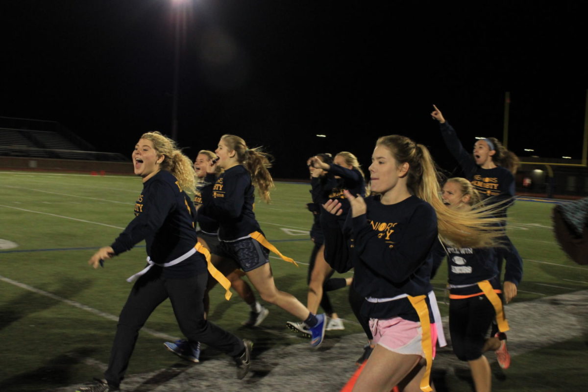 The senior team beat out both the sophomores and the freshmen. Megan Kostner leads the team onto the field to celebrate. The class of 2018 is back to back champs from last years season. 