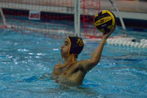 Senior Grant Ruster leads the Buccaneer offensive during a duel in a mid-season water polo tournament. He hopes to lead the squad to new heights this year, passing where they ended up last season.