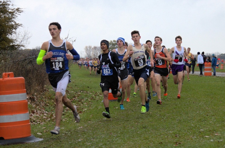 Junior Andrew Ireland bursts ahead, fighting the elements during the MHSAA state meet. Ireland closed out a solid campaign and looks to lead the team again next season.