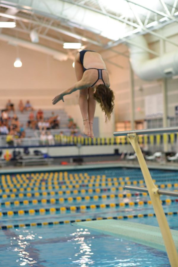 Junior diver Natalie Koetsier holds perfect form during an important dive in a conference meet at home earlier in the season. 