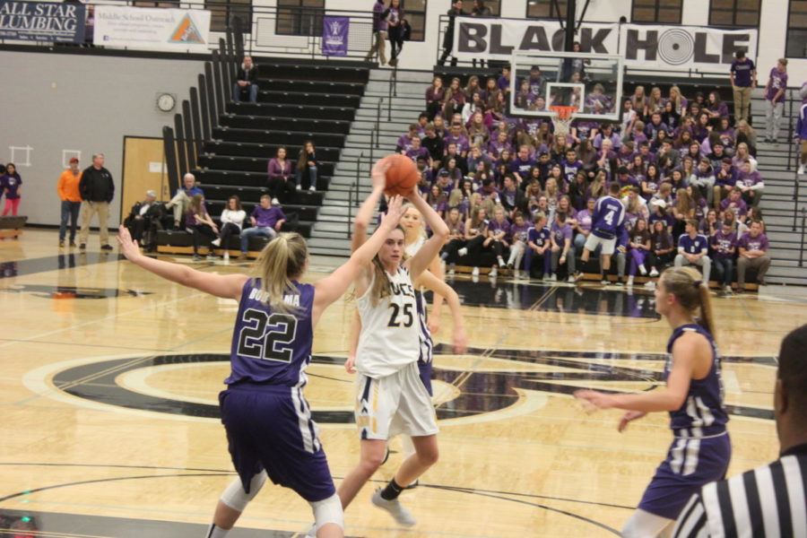 Senior Sophie Mariani challenges the brutal West Ottawa defense during a road game a few weeks back. The Lady Bucs turned it around last week, playing better, especially on senior night.