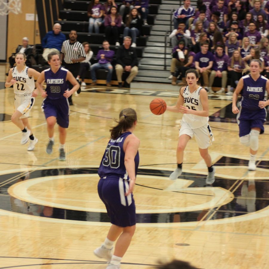 Senior Sophie Mariani takes the ball down the floor during a heated contest against the Panthers earlier this month.
