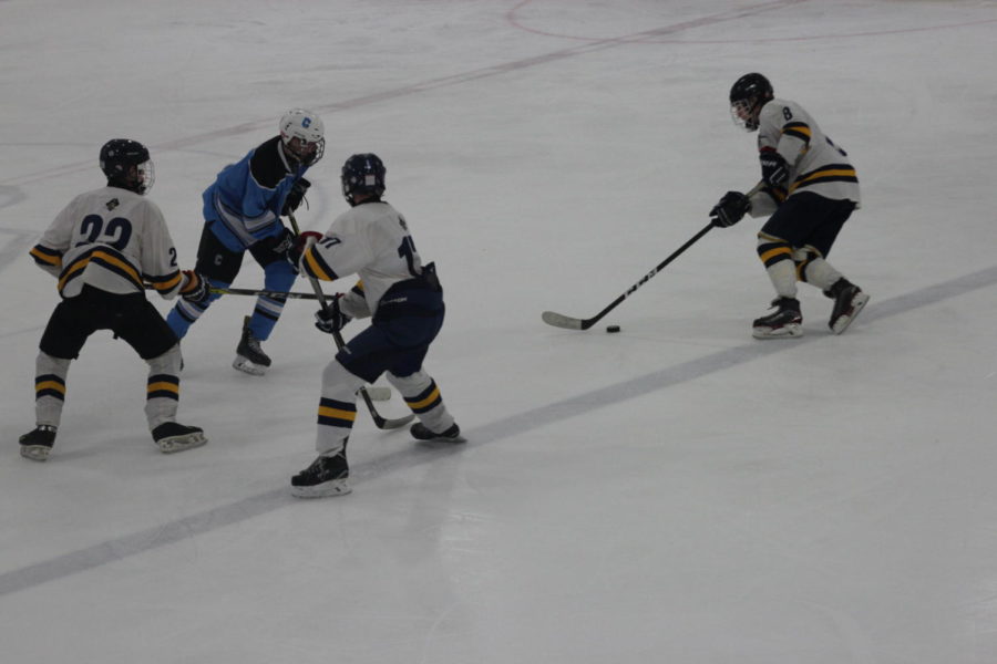 Senior Austin Fox fights through the blue line in a home contest earlier in the season. He has another great opportunity to bring the Bucs a win on Friday at home.