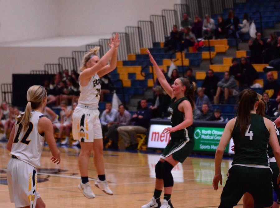 Junior Anna Strom fires up one of many three point shots she took during the successful season