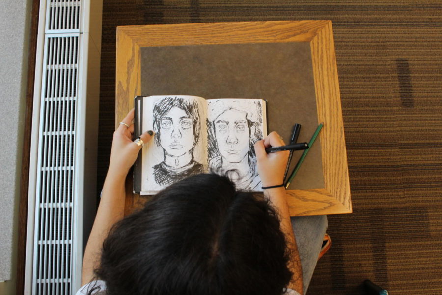 Senior Kaitlynn Park begins shading image in her sketch book. She has been drawing faces since eighth grade and still works to improve her skill. 