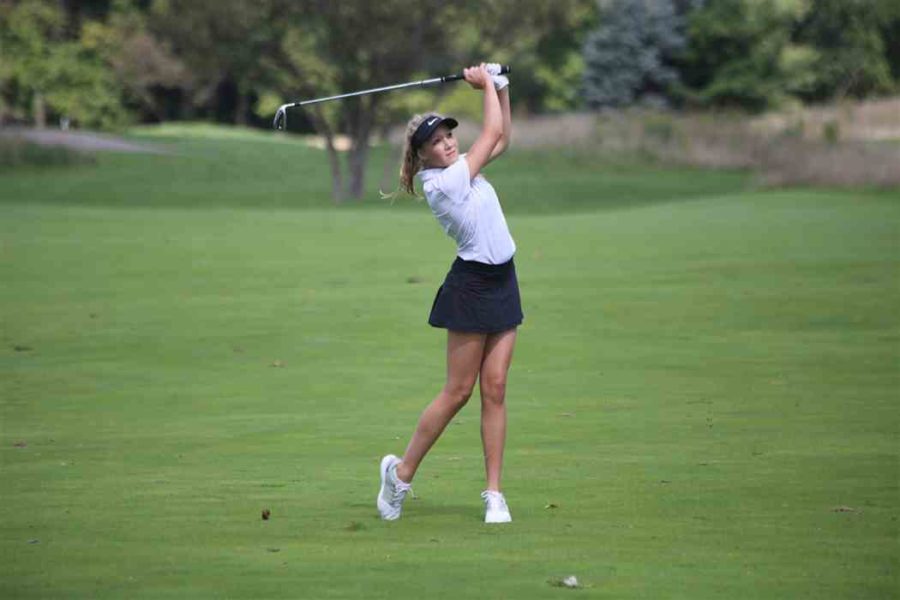 Freshman Caydee Constant stares down her shot at the mid-season tournament. Constant has been the key contributor for the golf team this year.