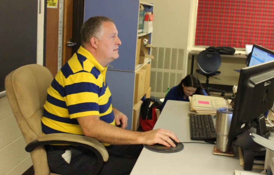 Teacher David Funk helps create a personalized schedule for one of many students that come to him for class advice. By having close connections with his students, Funk knows what will be best for their future