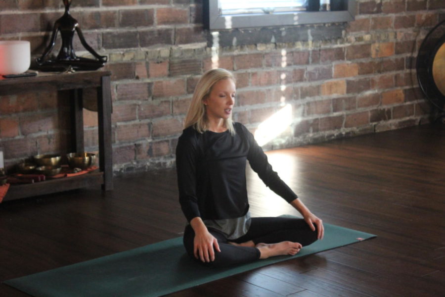 Yoga instructor Melissa Vannette meditates with her students. This is one of the many exercises she introduces in the class, along with sun salutations and restorative yoga.