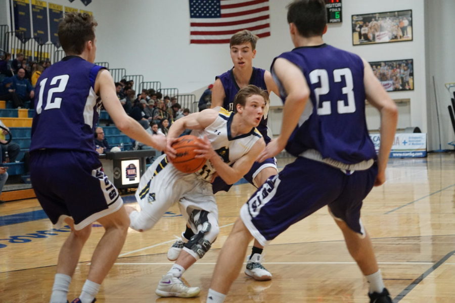 Senior point guard Casey Constant drives to the lane in a home game against Caledonia. Constant has led been a leader for the Bucs offensively and defensively.