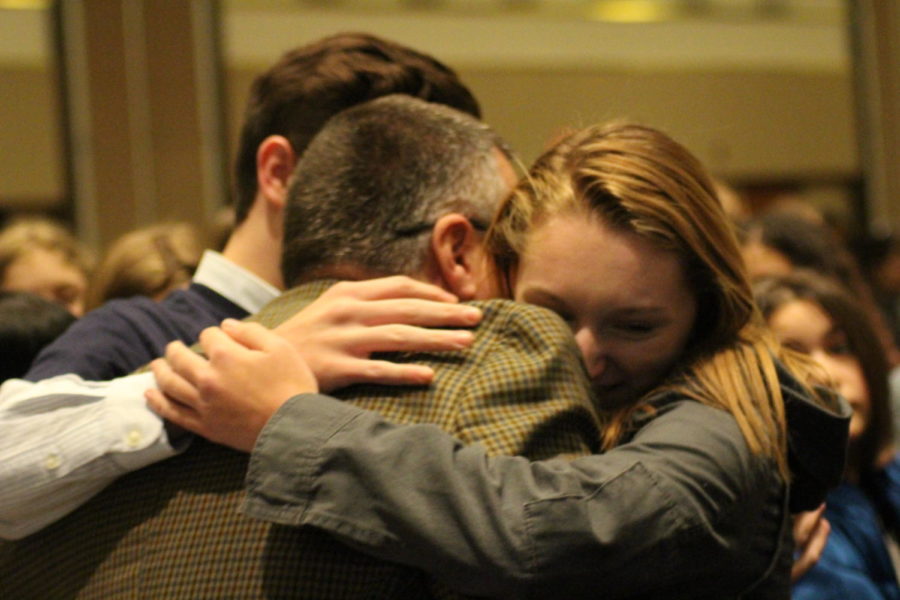 Co-Editors-in-Chief Chris Hudson and Maddie Monroe hug advisor C.E. Sikkenga after winning the Spartan Award.