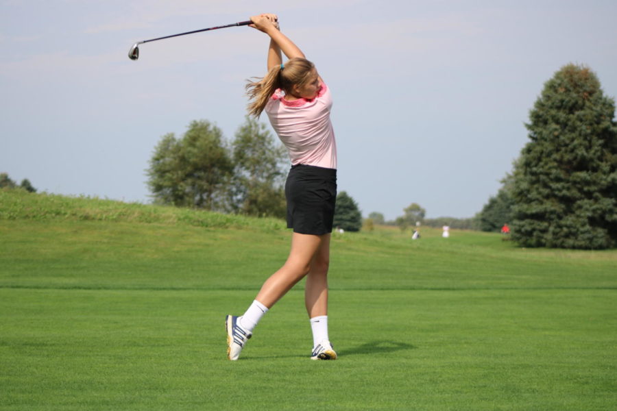 Sophomore Zoe Spoelman follows through as she finishes hitting the ball. The Grand Haven girls golf team competed in a tri meet on Tuesday September 10.