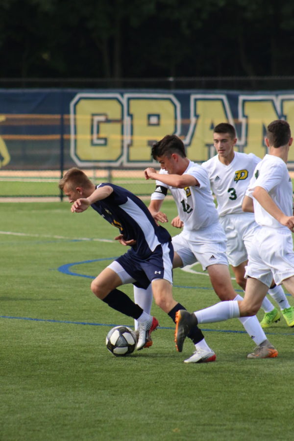 Senior Jaden King fends off opposing defenders on Saturday September 28. King won all-conference last season and is looking to repeat again this year.