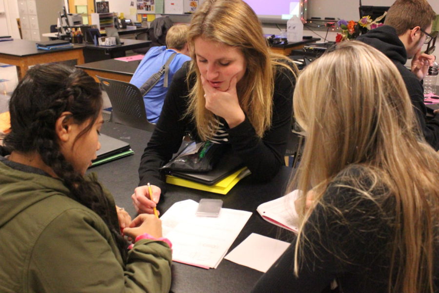 Walters helps engage students in magnetism project. 