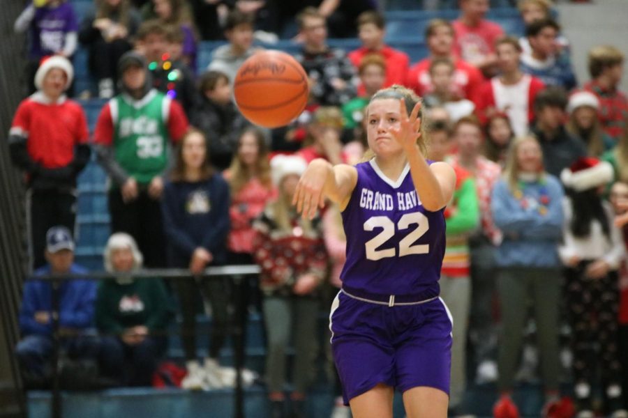Houle passes the ball in the Bucs Pride game against Spring Lake on Friday Dec. 20. Obviously, Im the coach, but she has played a lot of high level basketball and knows the game so well. I think she is a natural leader, Kowalczyk-Fulmer said.