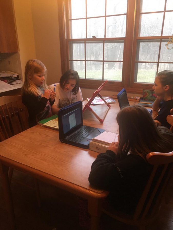 Senior Emma Chittenden teaches her two younger sisters and cousin amid school shutdown. 