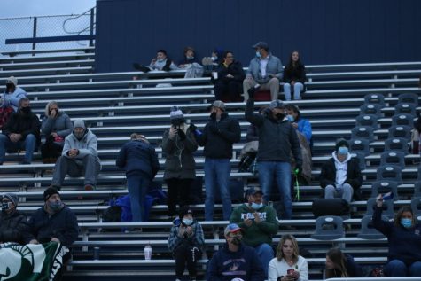 Spectators watch on during the Grand Haven v East Kentwood game. 