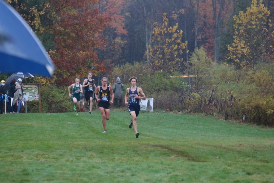 Nolan+Clark%2C+right%2C+sprints+towards+the+finish+line+during+Fridays+Pre-Regional+race+on+the+Grand+Haven+course.+Clark+finished+3rd+overall.+