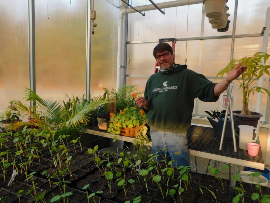 GREENHOUSE GOD: Glass shows different types of plants that students are growing in his Greenhouse Biology class whether it may be different types of vegetables or houseplants. 