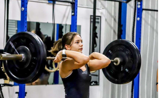 Makayla+Perrault+finishes+a+95+pound+clean+during+her+CrossFit+competition.+