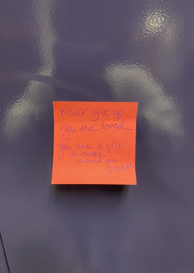 STICKY NOTE: one of the many sticky notes put on lockers. This one says Never give up, you are loved, you are a gift to those around you. Words like these can really make a difference in many peoples lives.  