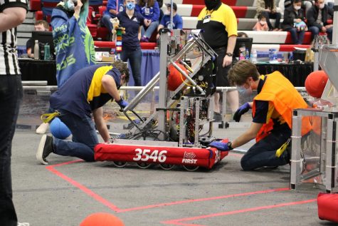 PERFECTION IS KEY: Final checks are done on the robot before the competition starts to make sure its dialed in and ready to go. 
(Photo by Jake Roberson)