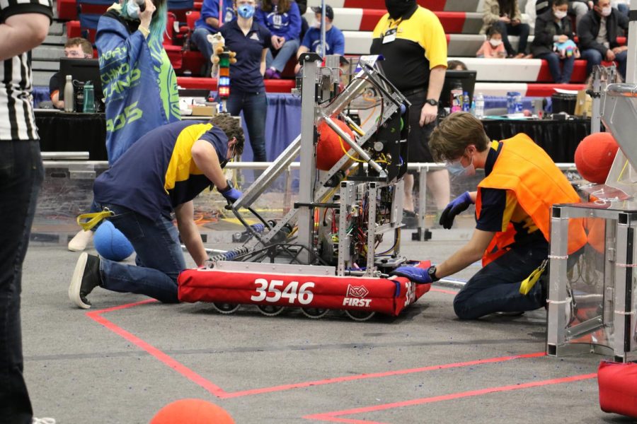 PERFECTION IS KEY: Final checks are done on the robot before the competition starts to make sure its dialed in and ready to go. 
(Photo by Jake Roberson)