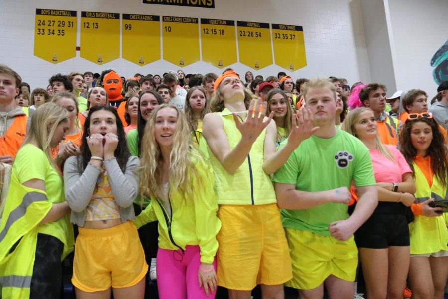STRENGTH IN NUMBERS: Large turn out of fans at the senior night game for both Buc teams. They wore neon to support Give and Glow. (photo by Emily Walcott)