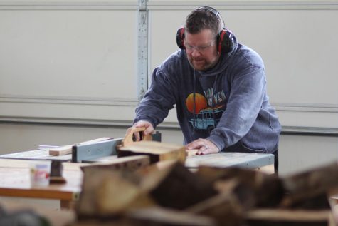 SAW IT: Brian Williams saws a small piece of wood to use in an upcoming project. 