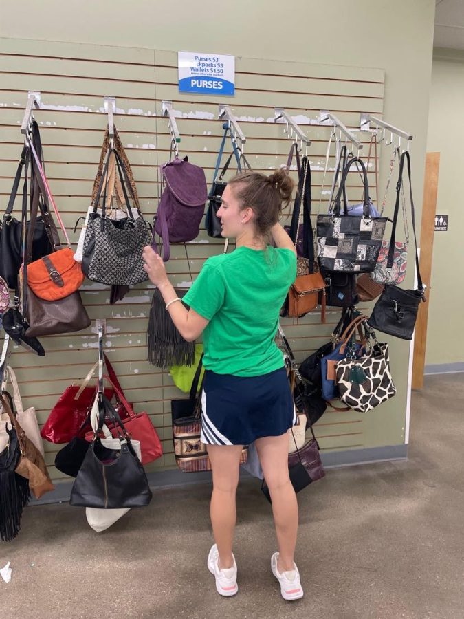 Senior Sammy Ritter picks out handbags at local Goodwill.