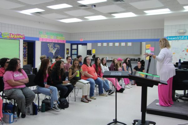 Teacher Juli Dick works with Chorale Ensemble as they continue to prepare for their upcoming concert on Oct. 9.
