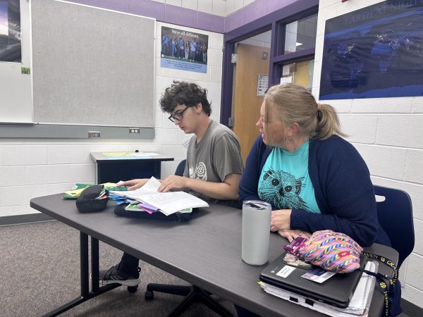 Jody Mahoney works with senior Japhy Myraad in his first hour class. She helps Japhy through all of his classes to enable him to succeed.